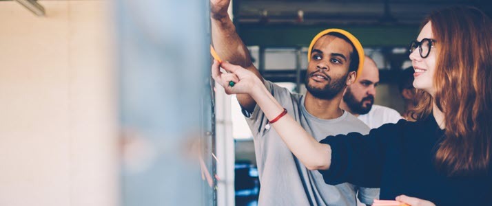 Male and female architects colleagues discussing ideas Male and female architects colleagues discussing ideas