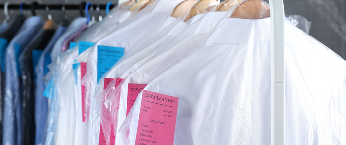 Employee Perks and Benefits A rack of cleaned shirts.
