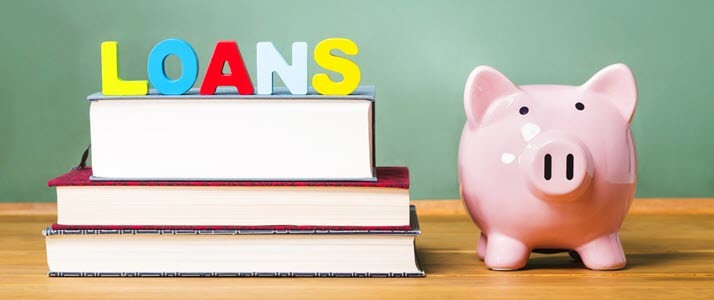 Student loan over textbooks with piggy bank