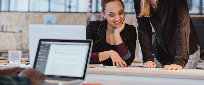 An employee shares a new idea with her supervisor