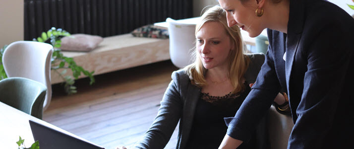 Employee Trust and Employee Engagement Two women looking at a laptop
