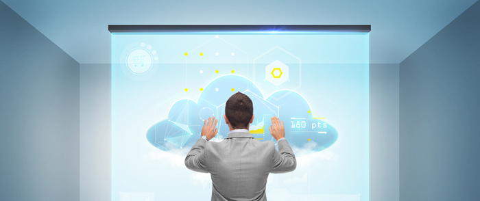 A businessman works with a cloud on a virtual screen.