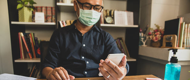 Businessman holding tablet with tax credit form visible Businessman holding tablet with tax credit form visible