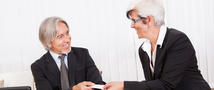 Employment Verification An HR leader discusses policies with a new employee.