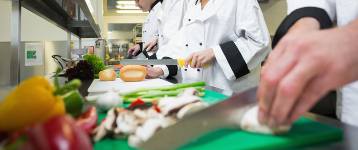 A line of cooks preparing food