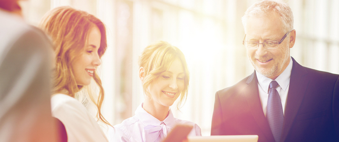 employer liability A group of employees of various ages working together on a project.