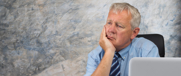 Older worker staring into space older worker staring into space