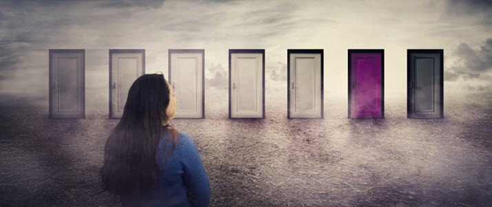 Woman looking at seven possible doorways to choose
