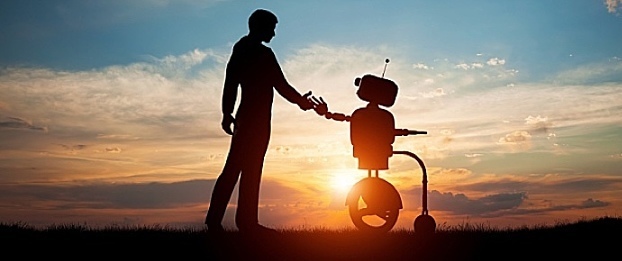 HCM technology A human hand reaches toward a robotic hand.