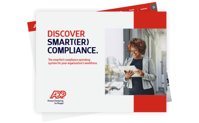 A female compliance professional, reading ADP's Smarter Compliance Guide, in an office next to a window
