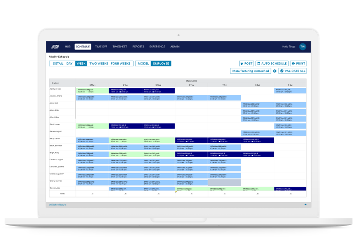 Managing employee schedules using ADP workforce management on a laptop
