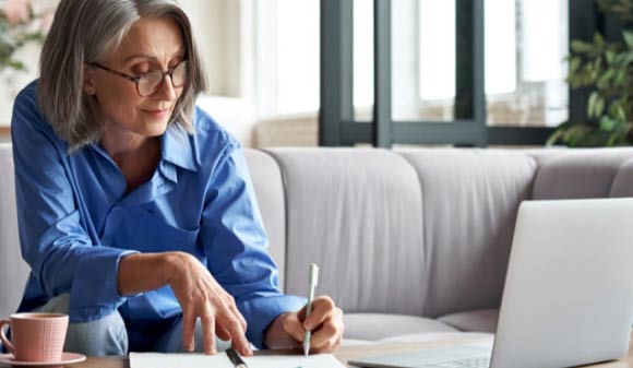 Woman using ADP Accelerate tools from her laptop