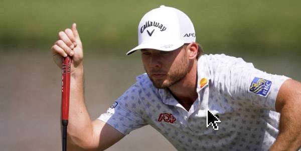 Golfer Sam Burns contemplating a golf shot