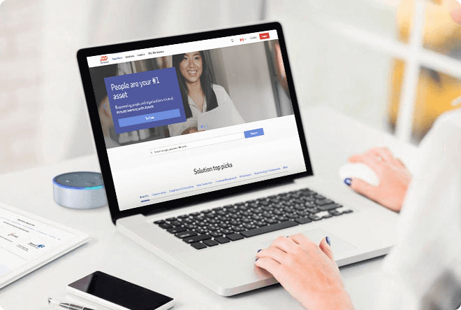 Laptop screen with an ADP solutions results page that is titled "People are your #1 asset"